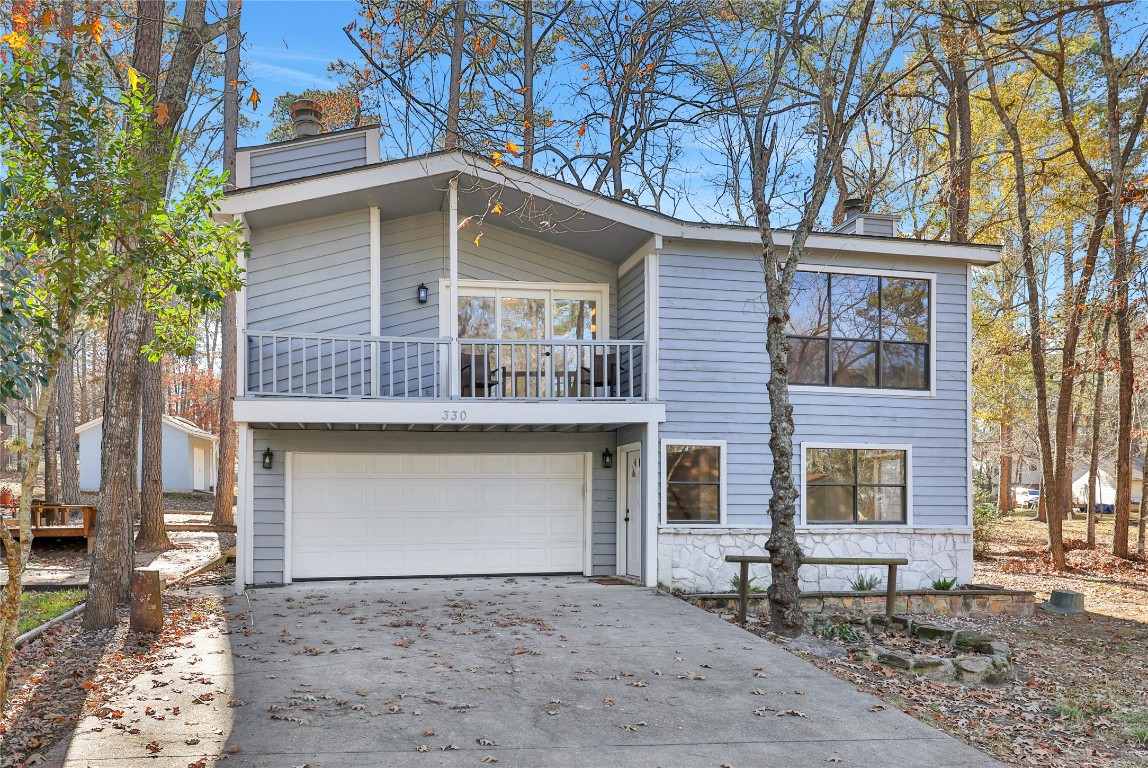 330 North Fairway Loop Coldspring, TX 77331 - Photo 28 of 40 Two car garage along with driveway parking