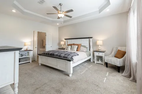 a bed room with a bed and a couch