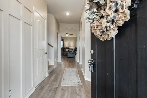 a view of hallway with chandelier