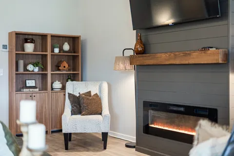a living room with furniture and a fireplace