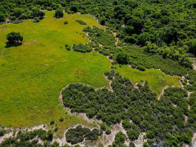 a view of a lake with a yard