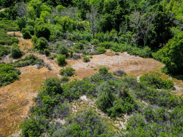 a view of a yard with an outdoor seating