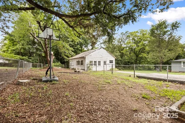a house with trees in the background