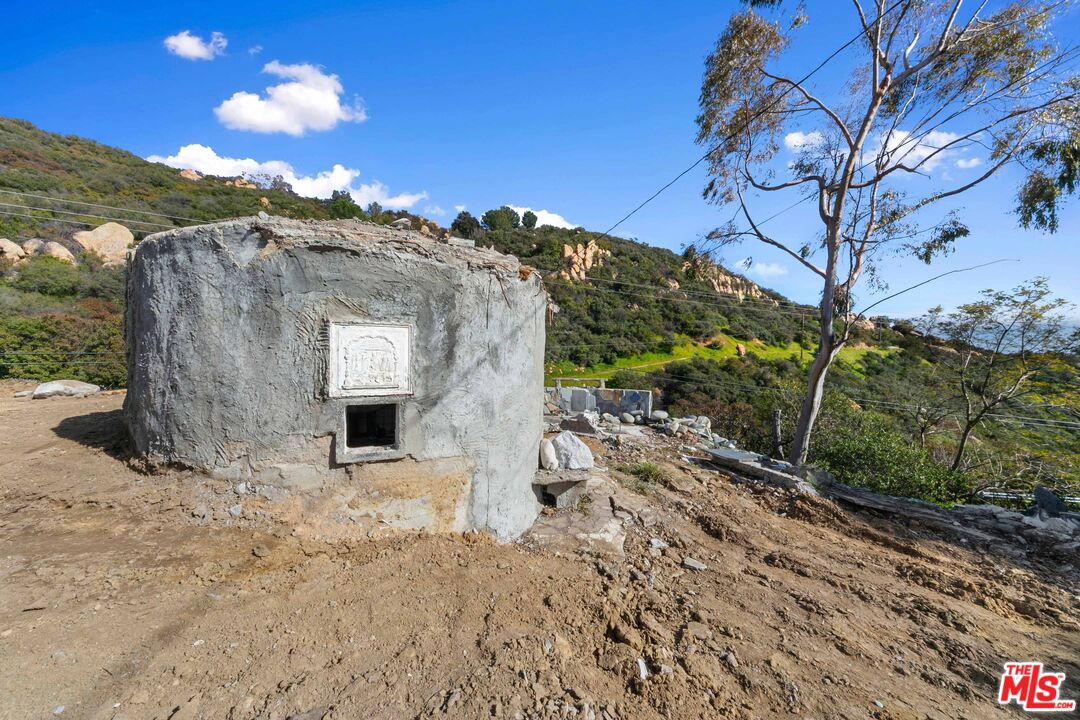 24641 Piuma Road Malibu, CA 90265 - Photo 15 of 40 a view of a house with a yard