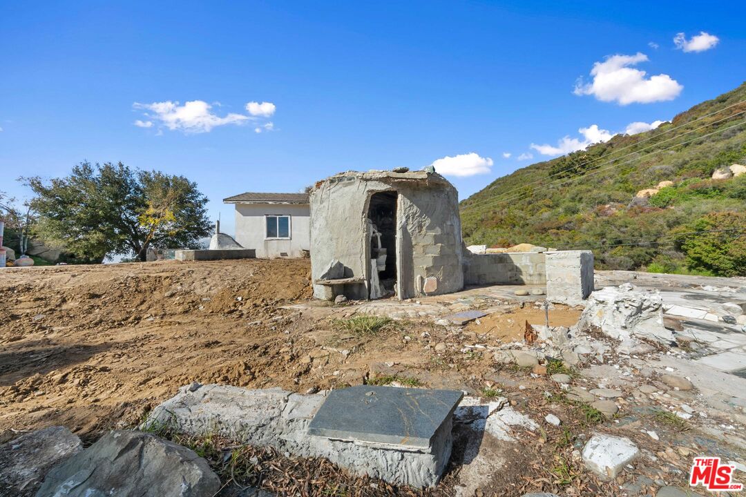 24641 Piuma Road Malibu, CA 90265 - Photo 16 of 40 a view of a house with a yard