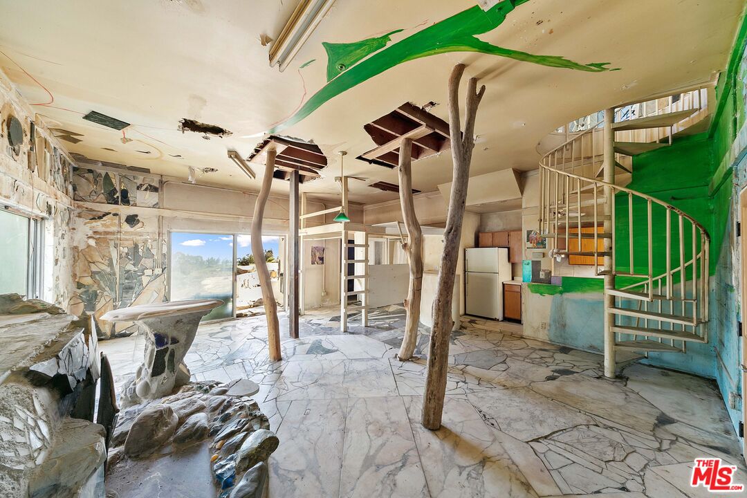 24641 Piuma Road Malibu, CA 90265 - Photo 20 of 40 a view of a patio with table and chairs