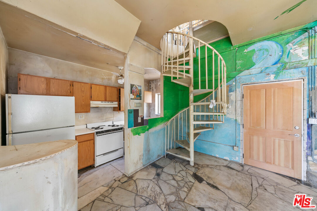 24641 Piuma Road Malibu, CA 90265 - Photo 22 of 40 a view of a kitchen with cabinets