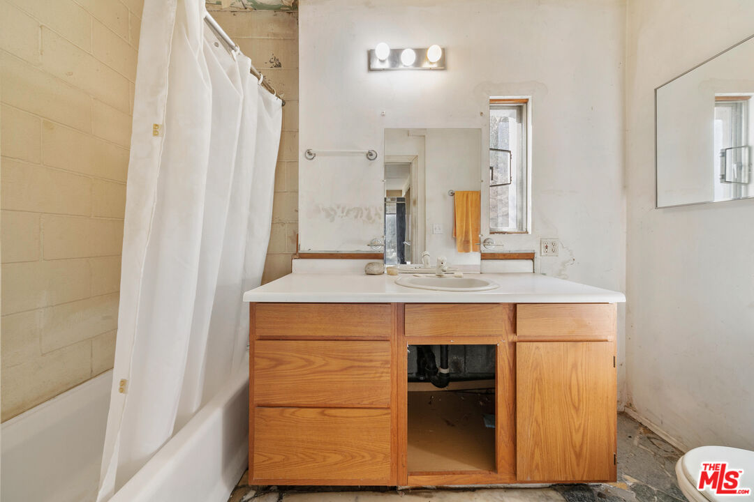 24641 Piuma Road Malibu, CA 90265 - Photo 25 of 40 a bathroom with a sink and a mirror