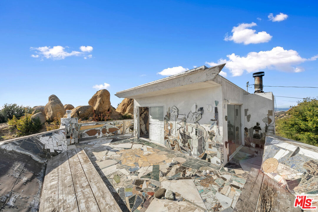 24641 Piuma Road Malibu, CA 90265 - Photo 31 of 40 a view of a house with a patio