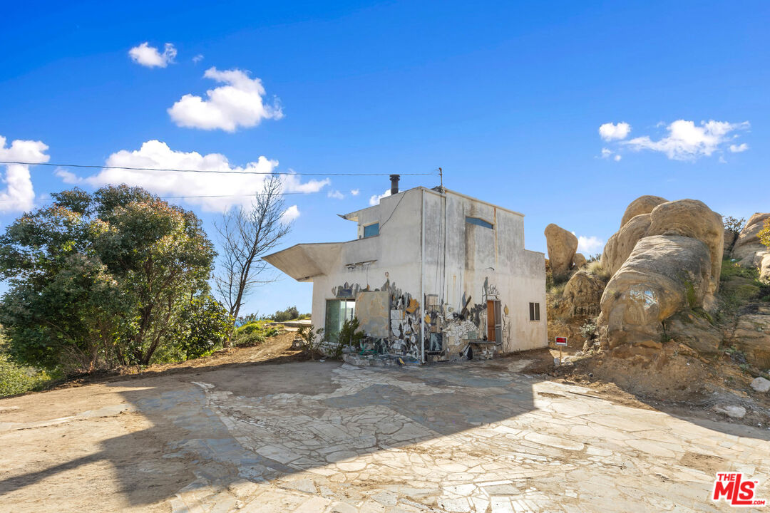 24641 Piuma Road Malibu, CA 90265 - Photo 8 of 40 a view of a fountain in front of the house