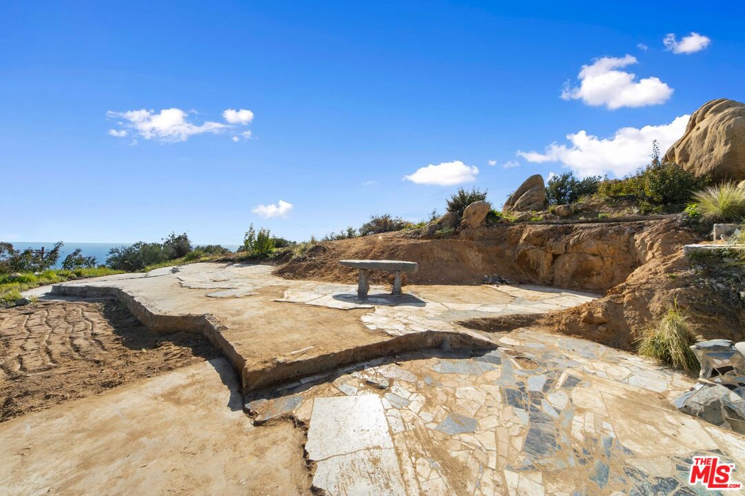 24641 Piuma Road Malibu, CA 90265 - Photo 9 of 40 a view of a backyard of a house with a yard