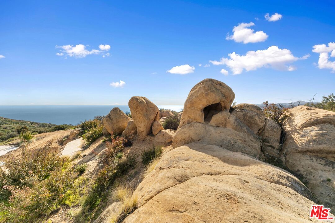 24641 Piuma Road Malibu, CA 90265 - Photo 10 of 40 a close view of a chandelier in big room