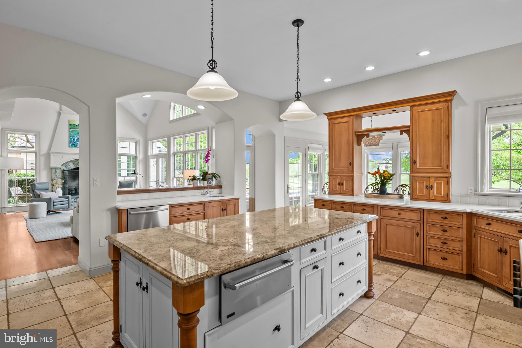 901 Greenside Drive Lititz, PA 17543 - Photo 14 of 45 a kitchen with granite countertop stove a sink a dining table and chairs