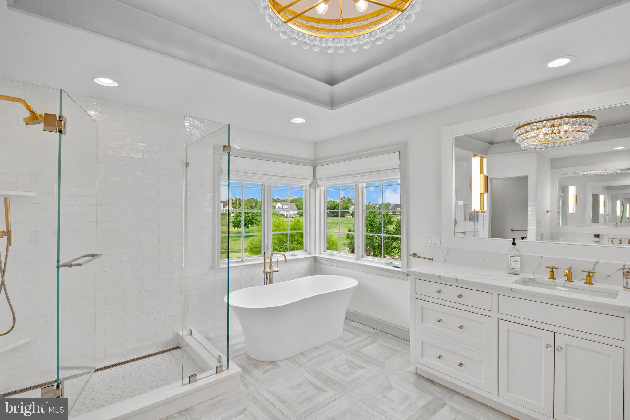 901 Greenside Drive Lititz, PA 17543 - Photo 29 of 45 a spacious bathroom with a double vanity sink a large mirror and a bathtub