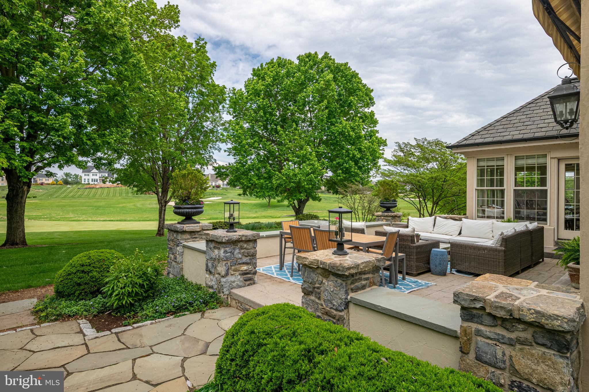 901 Greenside Drive Lititz, PA 17543 - Photo 41 of 45 a backyard of a house with fountain table and chairs