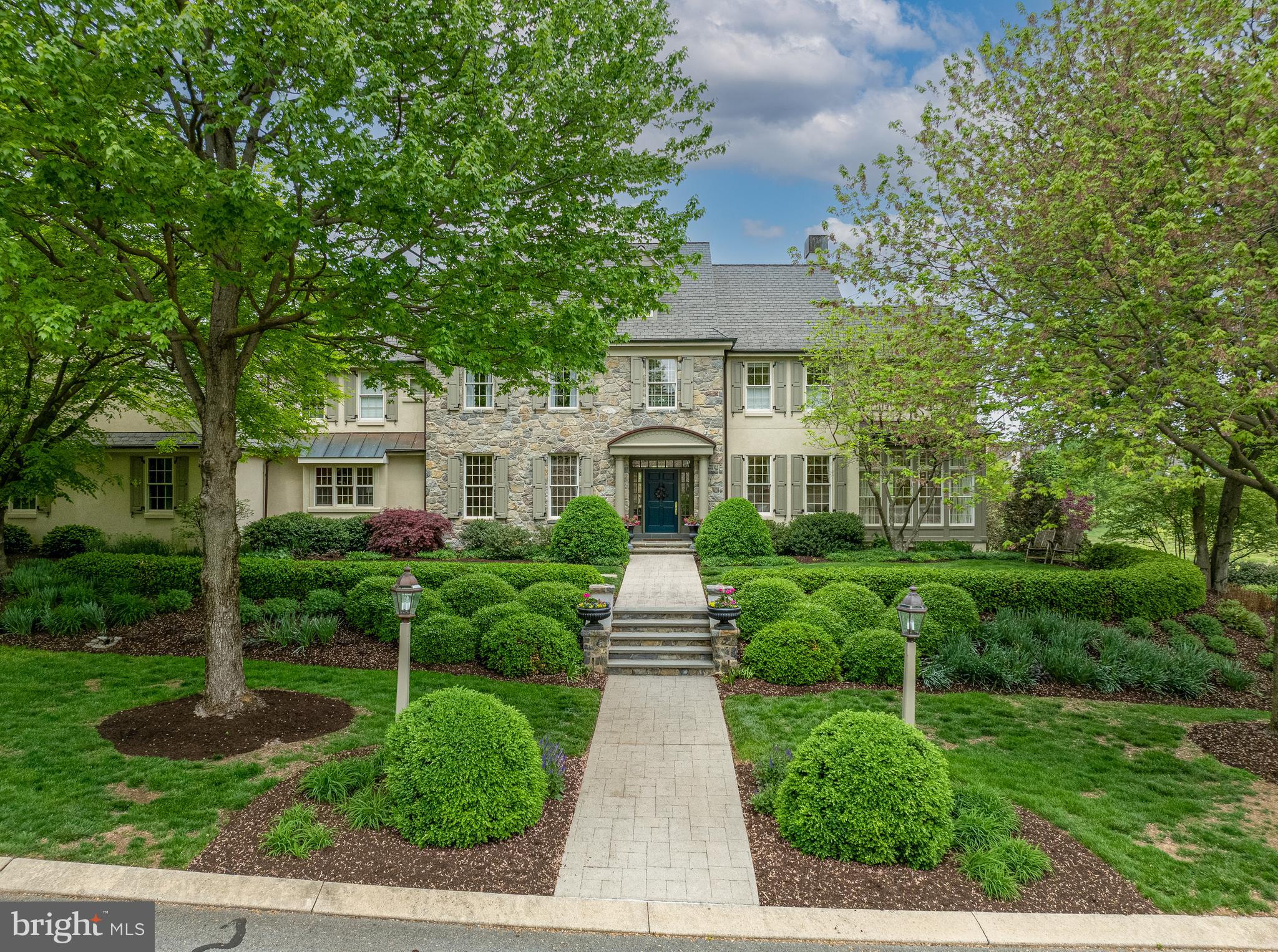 901 Greenside Drive Lititz, PA 17543 - Photo 44 of 45 a front view of a house with garden and trees