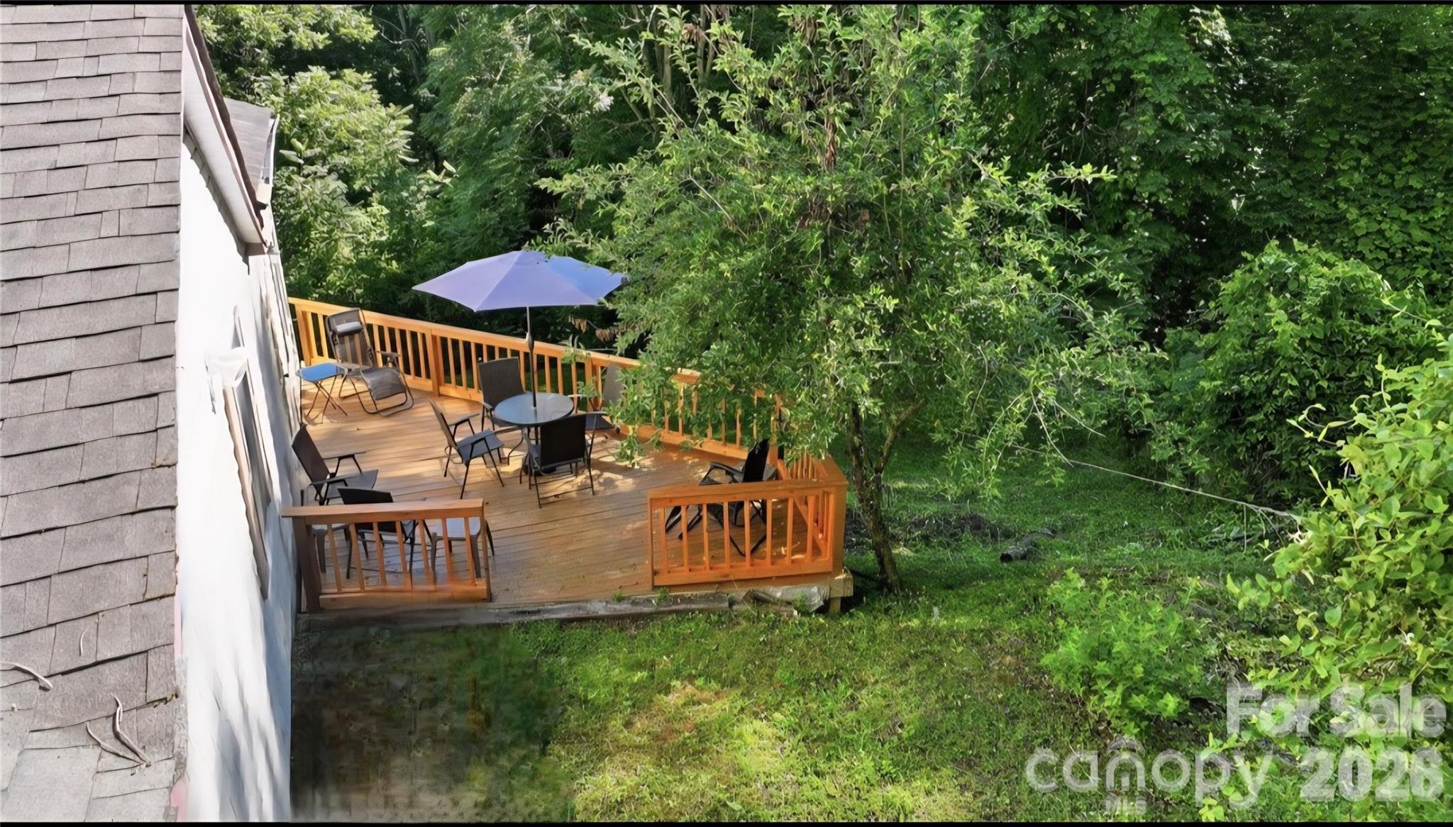 583 Dark Ridge Road Sylva, NC 28779 - Photo 12 of 48 a view of a chair and table in the garden
