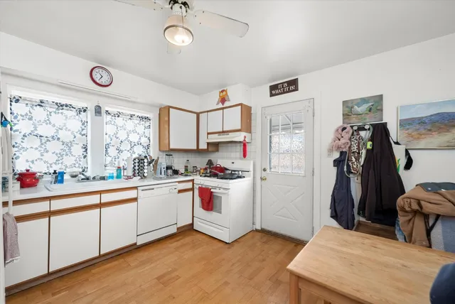 a kitchen with a refrigerator and window