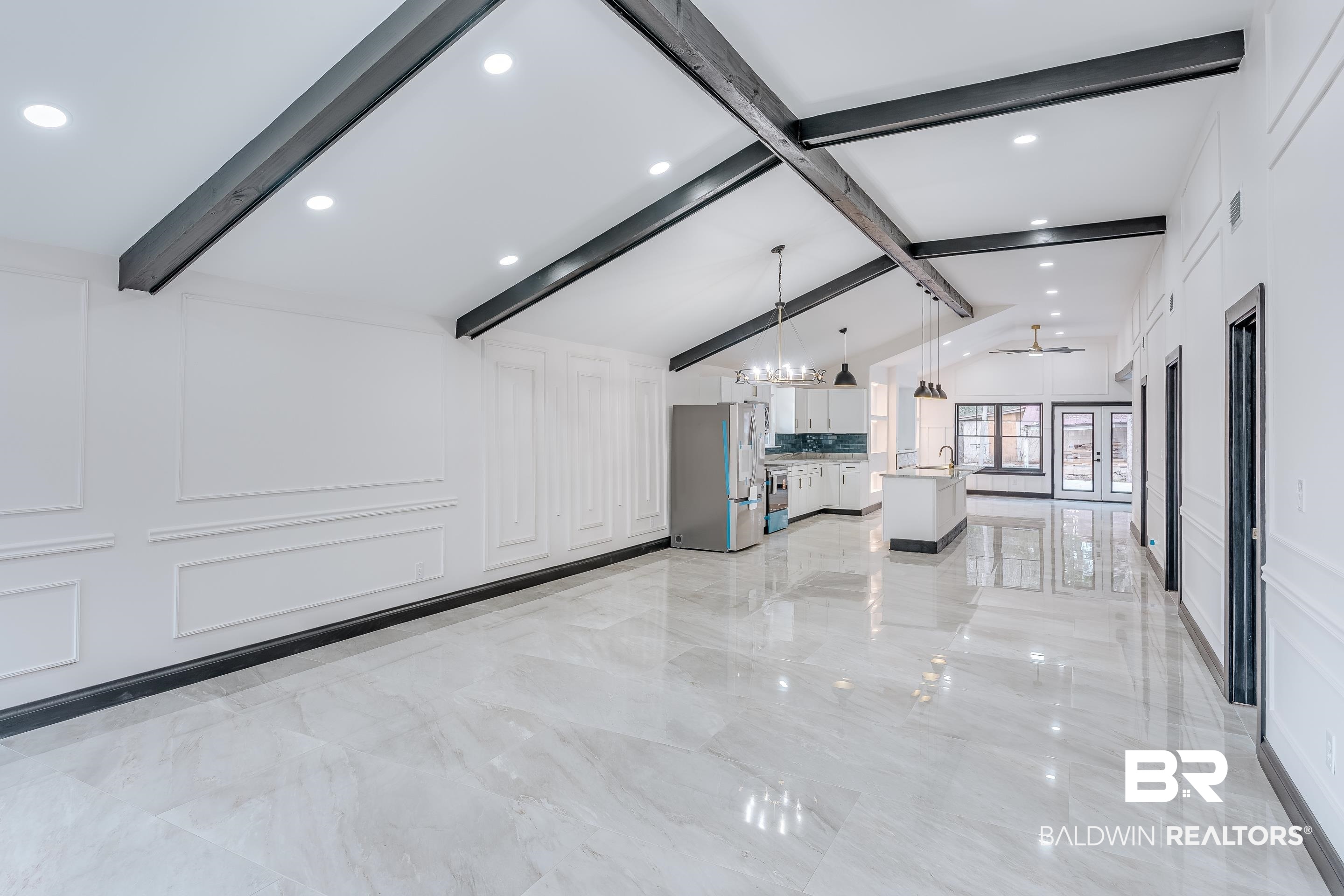 1190 Military Road Mount Vernon, AL 36560 - Photo 2 of 47 Unfurnished living room featuring light marble finish floors, a decorative wall, a chandelier, and recessed lighting
