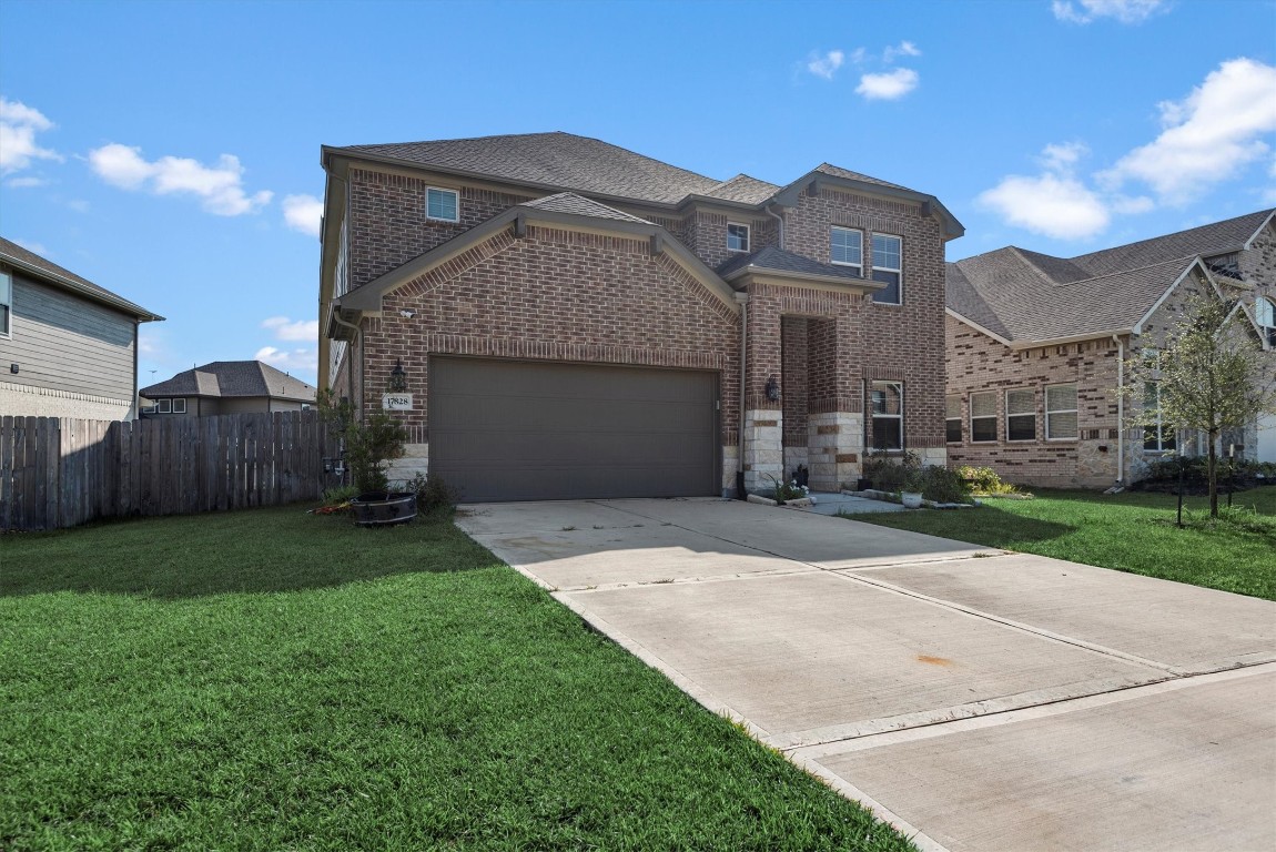 17828 Hanson Ridge Drive Montgomery, TX 77316 - Photo 1 of 47 a front view of a house with garden