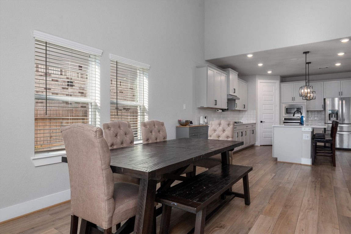 17828 Hanson Ridge Drive Montgomery, TX 77316 - Photo 14 of 47 a view of a dining room with furniture and wooden floor