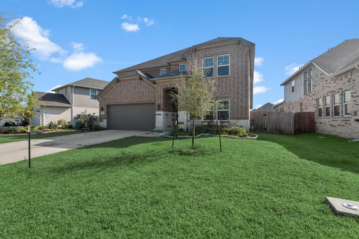 17828 Hanson Ridge Drive Montgomery, TX 77316 - Photo 2 of 47 a house view with a garden space