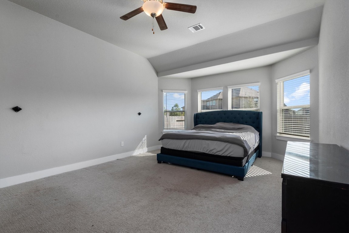 17828 Hanson Ridge Drive Montgomery, TX 77316 - Photo 21 of 47 a spacious bedroom with a bed and a window