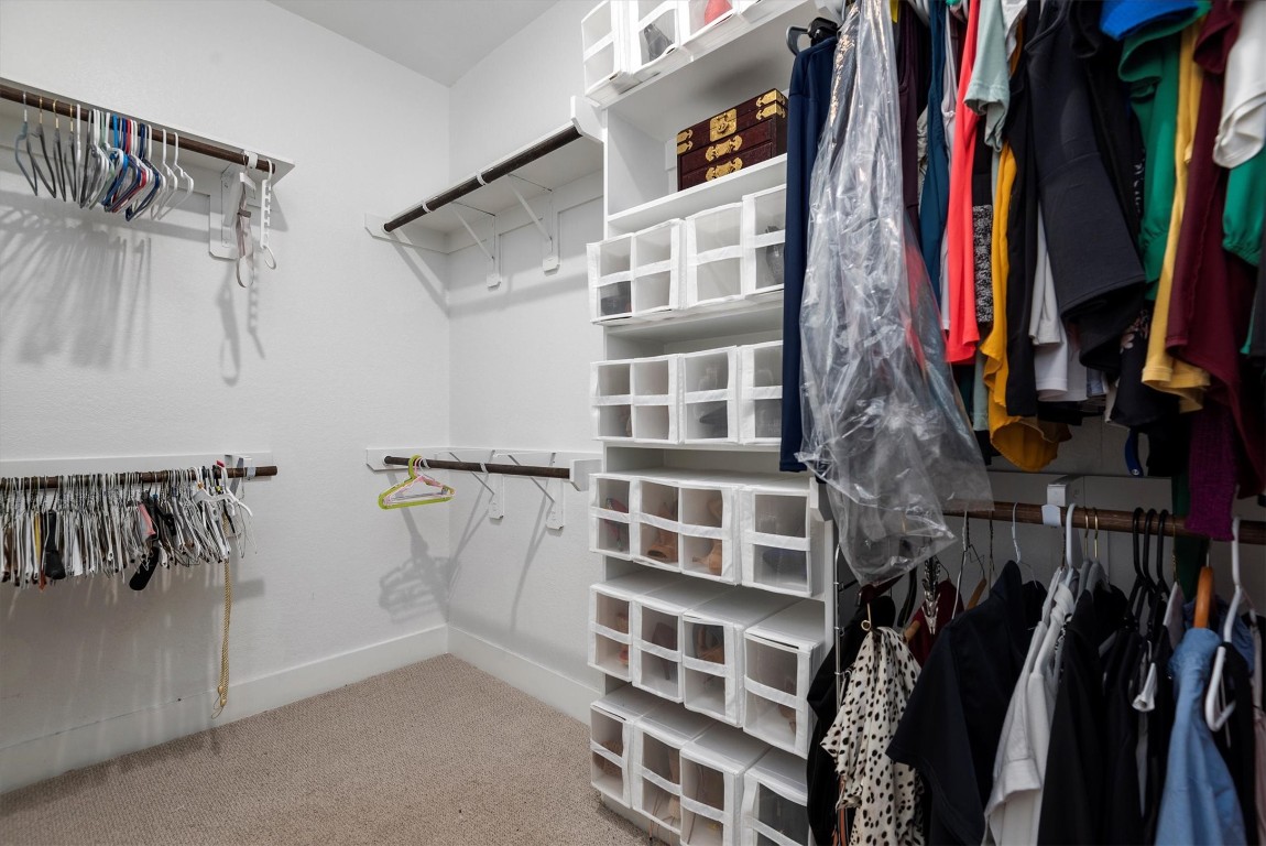 17828 Hanson Ridge Drive Montgomery, TX 77316 - Photo 40 of 47 a view of walk in closet with clothes and shoes