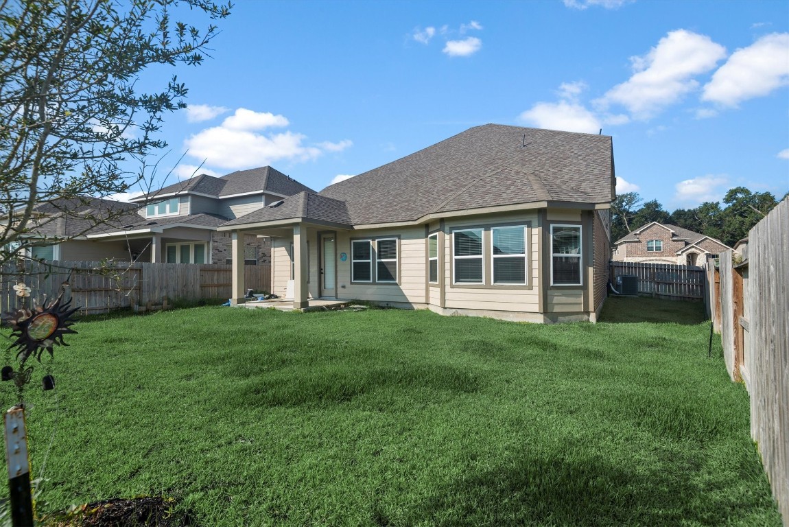 17828 Hanson Ridge Drive Montgomery, TX 77316 - Photo 45 of 47 a view of a house with a backyard