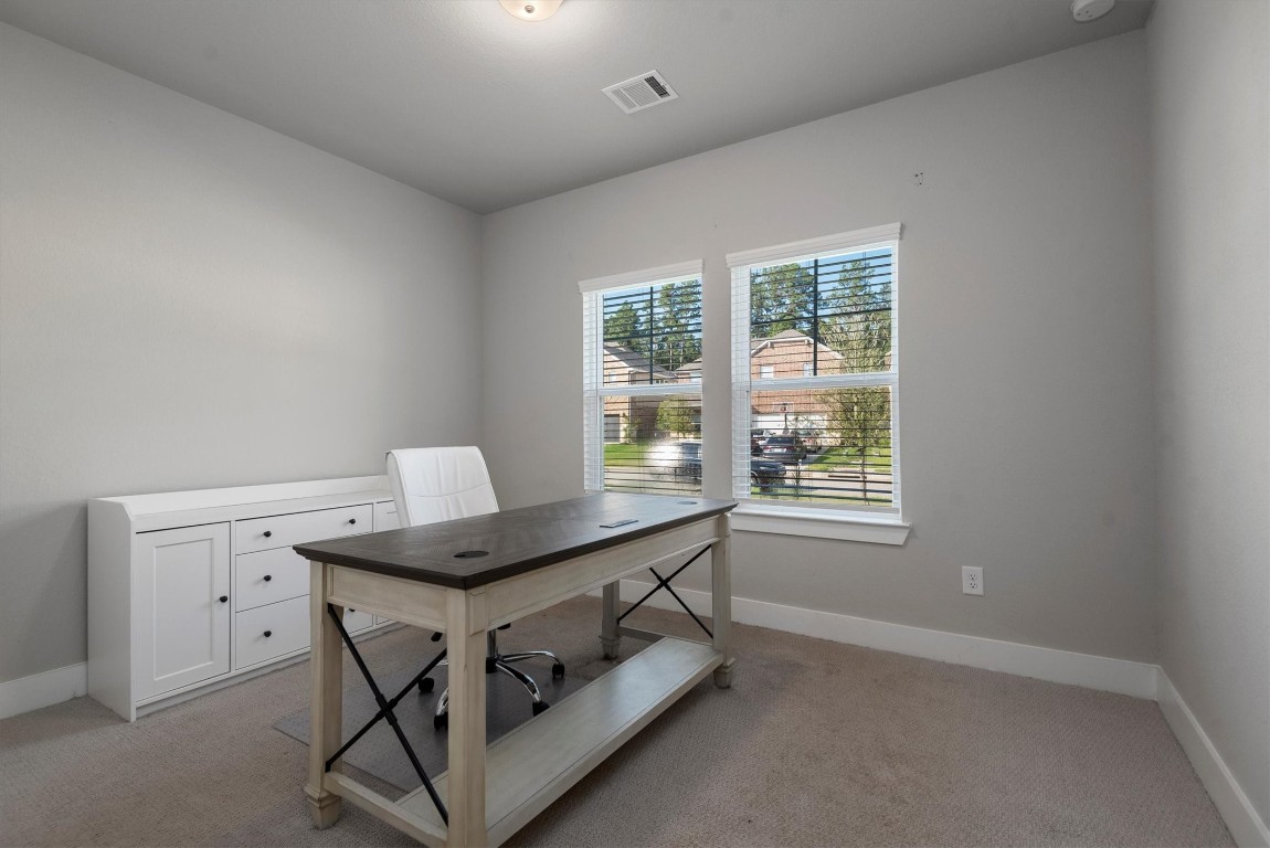17828 Hanson Ridge Drive Montgomery, TX 77316 - Photo 6 of 47 a room with a table and windows