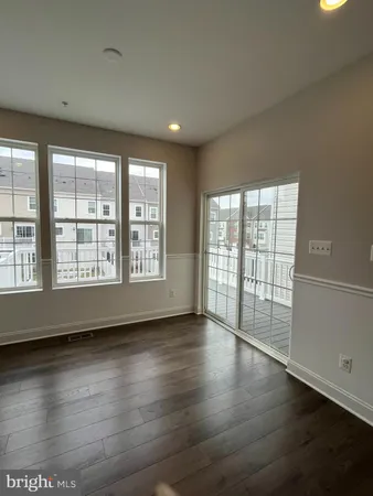 a view of a house with wooden fence