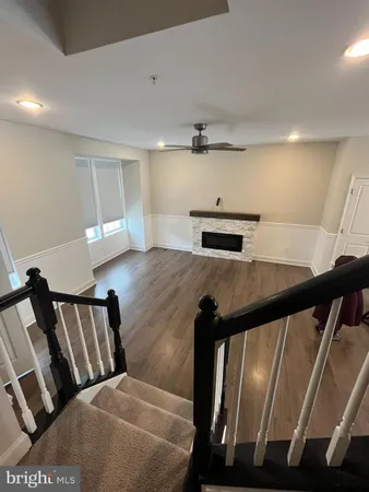 a view of an entryway with wooden floor