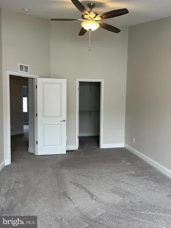 a bathroom with a granite countertop sink mirror and shower