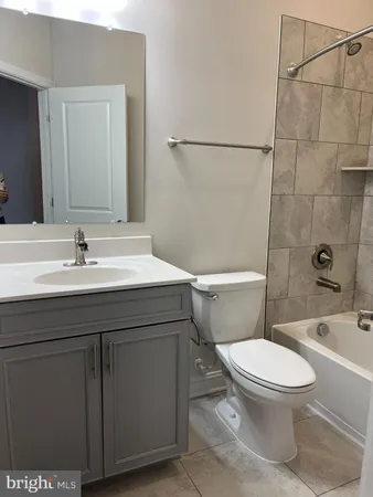 a bathroom with a bathtub and a toilet