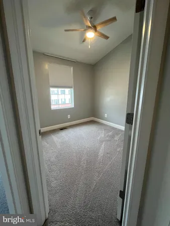 a bathroom with a sink toilet and a mirror