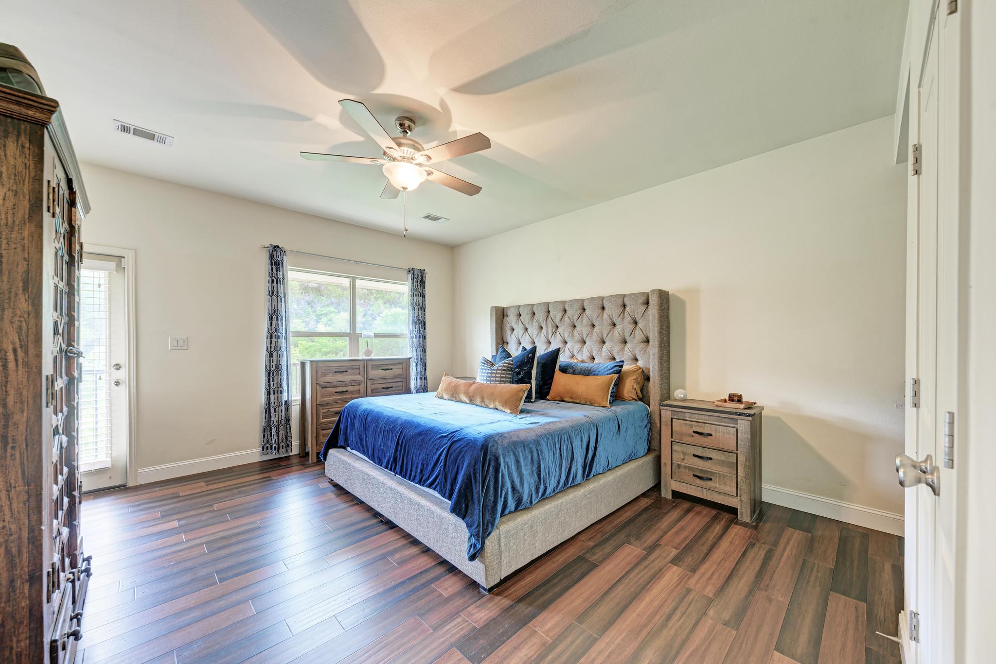 2605 Indian Creek Road Austin, TX 78734 - Photo 11 of 33 Spacious room featuring wood-finish flooring, a ceiling fan, and a window with natural light