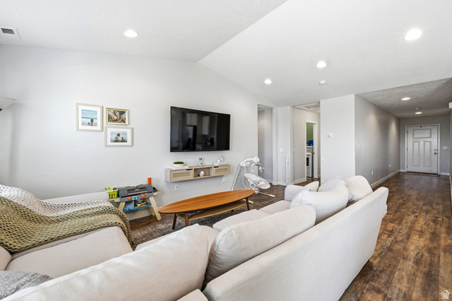 1175 Silver Hollow Road Syracuse, UT 84075 - Photo 6 of 34 Spacious living area featuring light-toned walls, recessed lighting, and wood-finish flooring