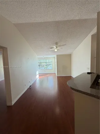 a view of wooden floor and cabinet in a room