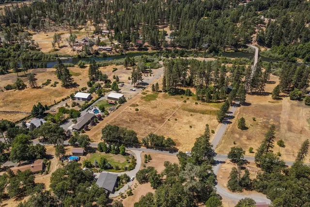 a view of outdoor space with swimming pool and lake view