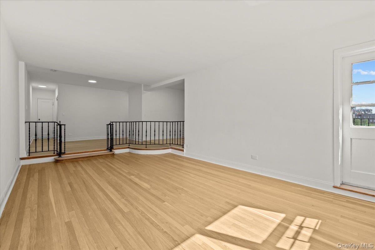 3635 Johnson Avenue, Unit 4M Bronx, NY 10463 - Photo 15 of 21 a view of an empty room with wooden floor