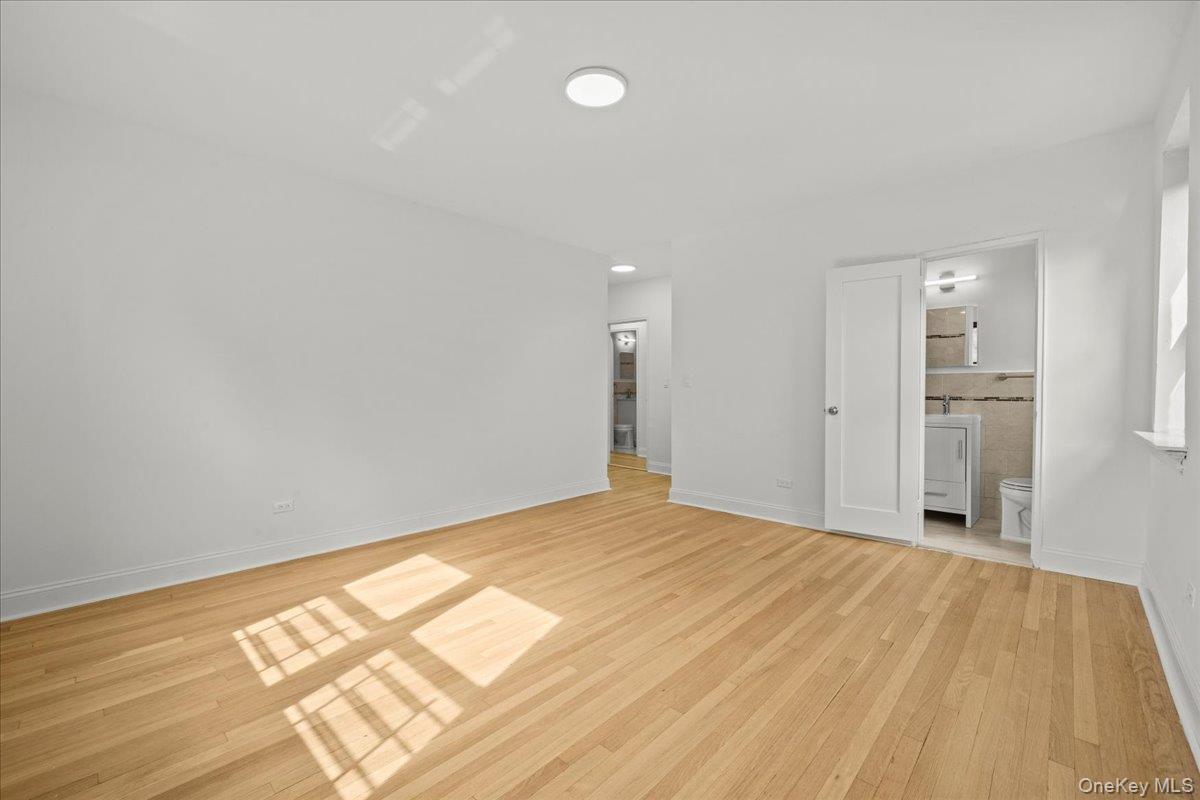 3635 Johnson Avenue, Unit 4M Bronx, NY 10463 - Photo 19 of 21 a view of empty room with wooden floor
