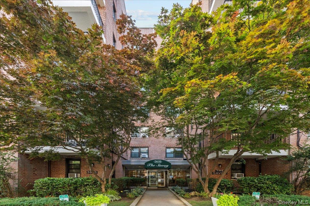 3635 Johnson Avenue, Unit 4M Bronx, NY 10463 - Photo 2 of 21 a front view of a building with trees