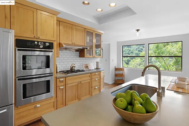 a view of a dinning table and chairs on the roof deck