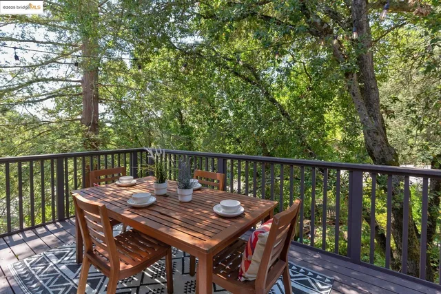 a view of a backyard with sitting area and furniture