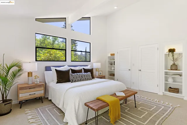 a workspace with furniture a rug and a window