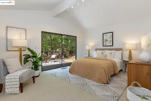 a bedroom with a bed and a table