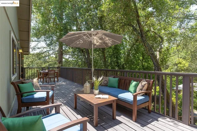 a backyard of a house with lots of green space and trees all around