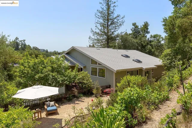 a roof deck with a table and chairs