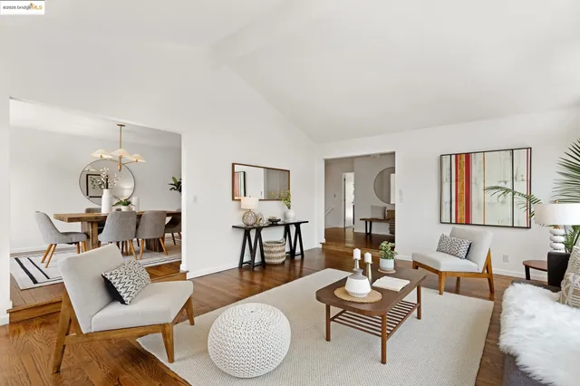 a kitchen with stainless steel appliances a stove a sink cabinets and a window
