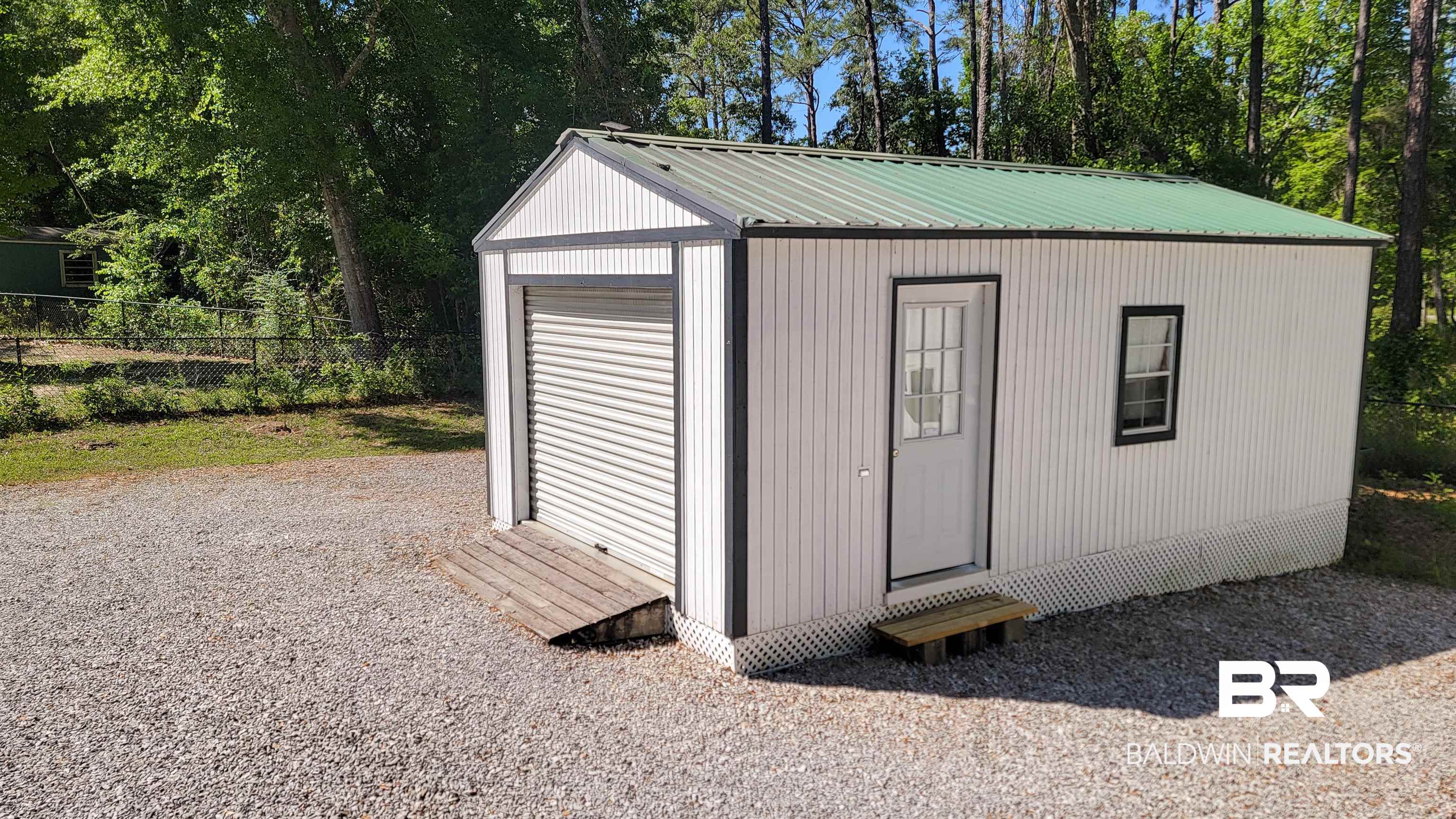 9902 Clarke Ridge Road Foley, AL 36535 - Photo 56 of 61 View of outbuilding with fence, an outbuilding, and entry steps